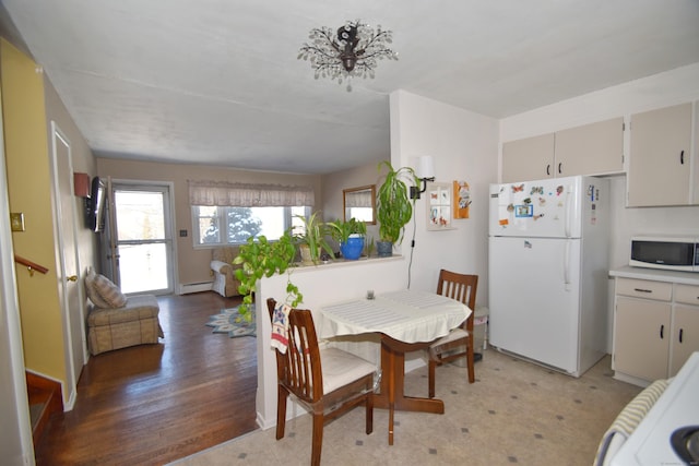 dining area with baseboard heating