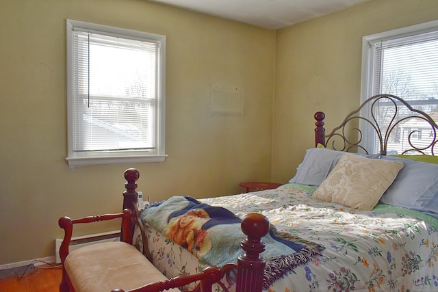 bedroom with hardwood / wood-style flooring