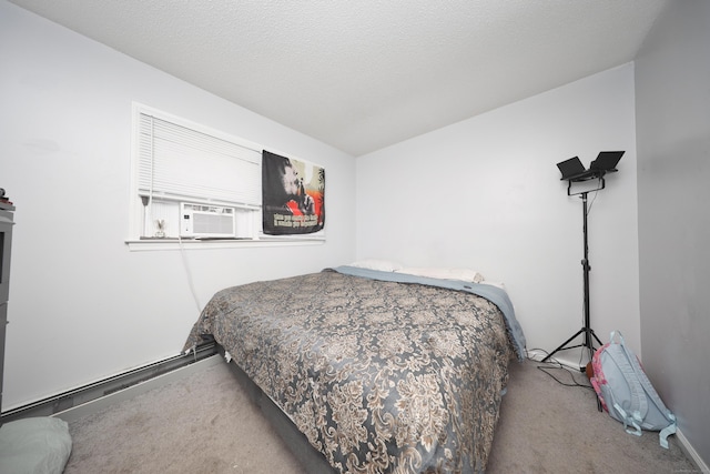 carpeted bedroom with cooling unit and a textured ceiling