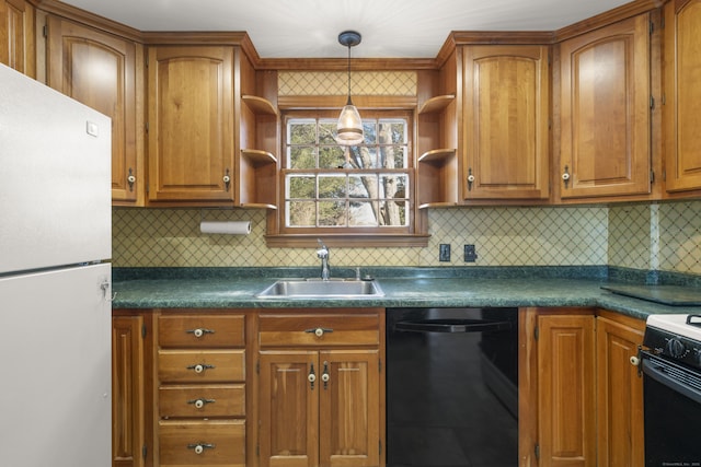 kitchen with sink, pendant lighting, backsplash, and black appliances