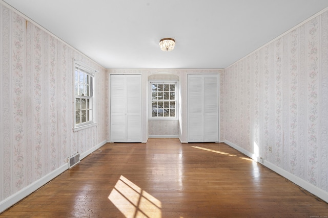 unfurnished room featuring hardwood / wood-style floors