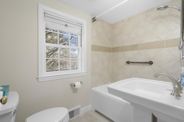 bathroom featuring sink and toilet