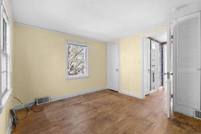 unfurnished bedroom with wood-type flooring