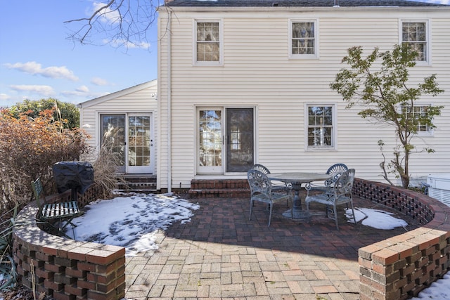 back of property featuring a patio area