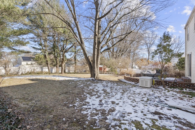 view of yard layered in snow