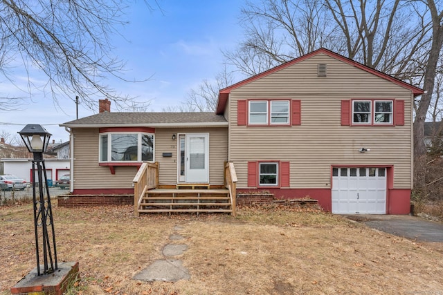 split level home featuring a garage