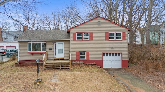 split level home featuring a garage