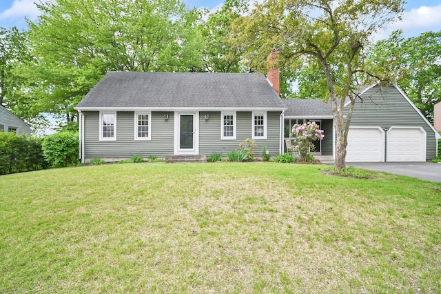 4 Sparkle St, Enfield, CT 06082 - view of front of house featuring a chimney, asphalt driveway, a front yard, and an attached garage