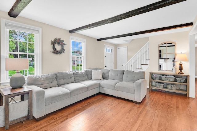4 Sparkle St, Enfield, CT 06082 - living area featuring beamed ceiling, wood finished floors, and stairs