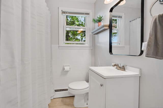 4 Sparkle St, Enfield, CT 06082 - full bath featuring a baseboard radiator, tile patterned floors, tile walls, vanity, and toilet