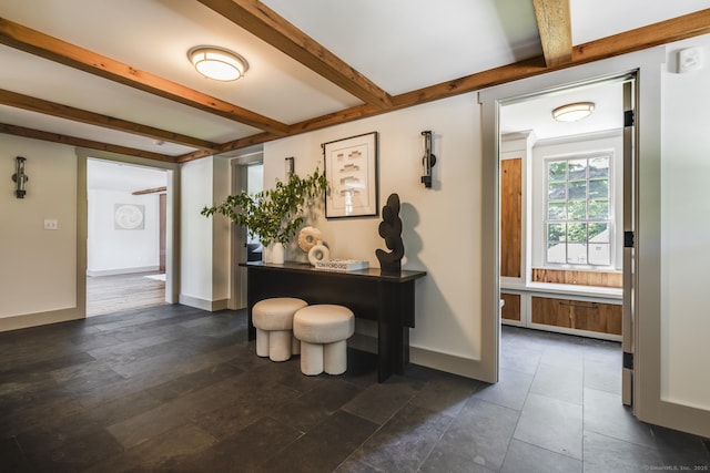 interior space featuring beamed ceiling