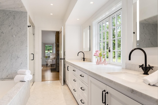 bathroom featuring vanity, wood-type flooring, and french doors