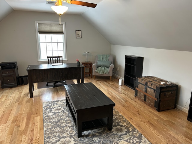 office space featuring light hardwood / wood-style flooring and vaulted ceiling