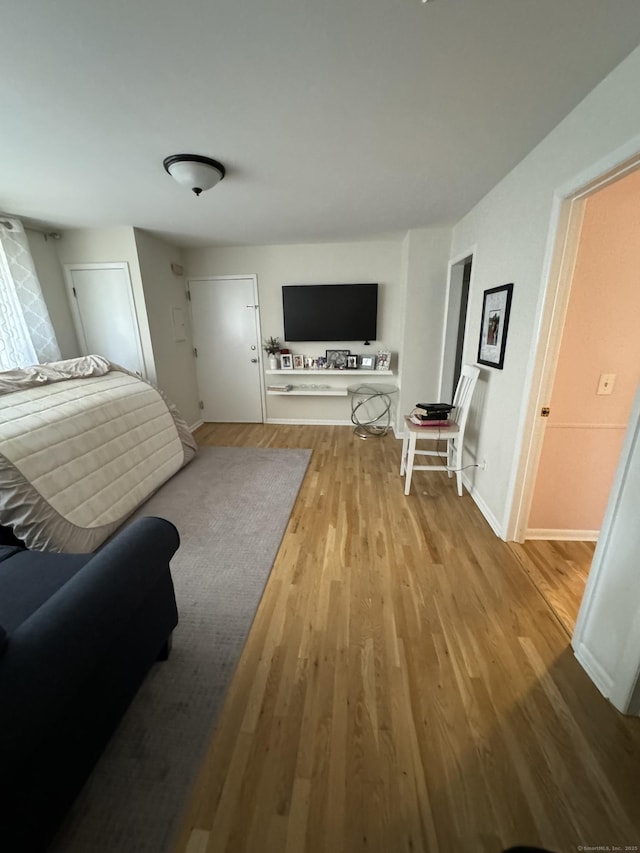 bedroom with light wood-type flooring