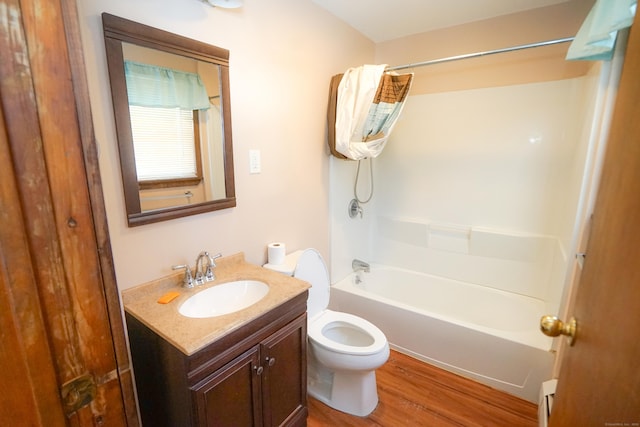 full bathroom with shower / tub combination, hardwood / wood-style floors, vanity, a baseboard radiator, and toilet