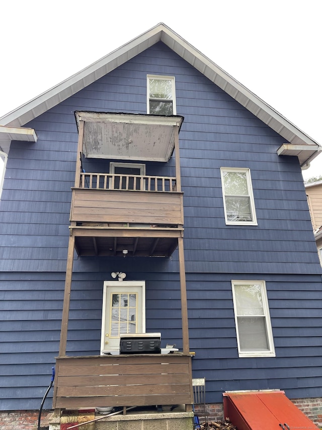 rear view of house featuring a balcony