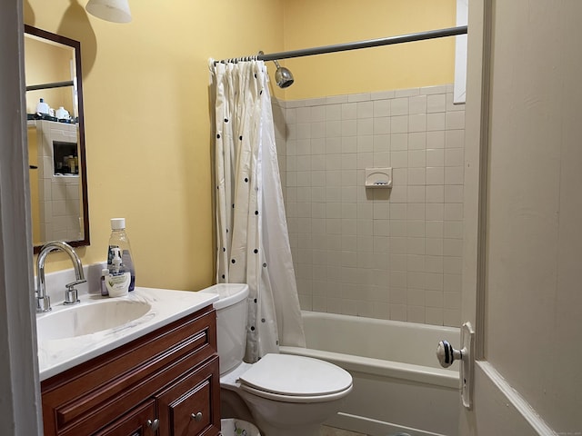 full bathroom featuring toilet, vanity, and shower / tub combo with curtain