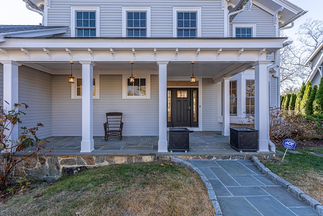 doorway to property with covered porch