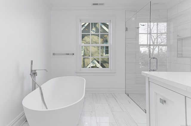 bathroom with a healthy amount of sunlight, crown molding, and separate shower and tub