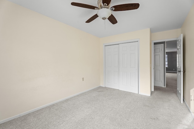 unfurnished bedroom featuring ceiling fan and carpet floors