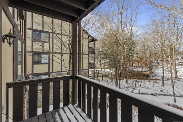 view of snow covered deck