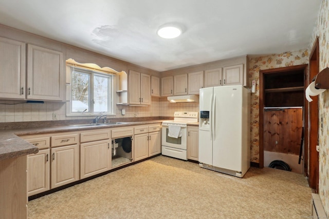 kitchen with sink, white appliances, and light brown cabinetry