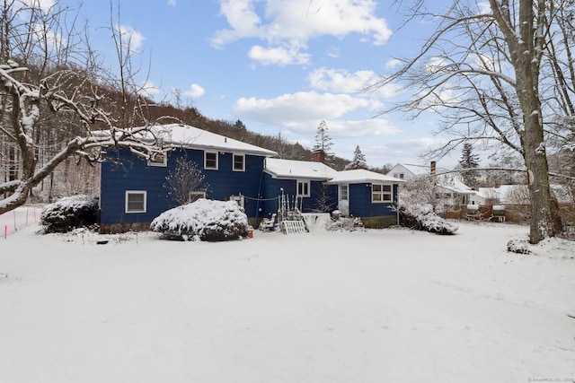 view of snow covered house