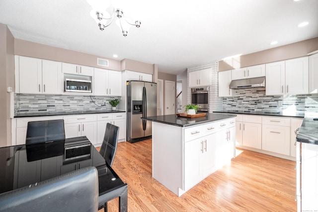 kitchen featuring a center island, white cabinets, and appliances with stainless steel finishes