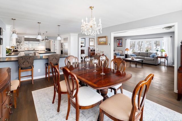 dining room featuring dark hardwood / wood-style flooring and a notable chandelier