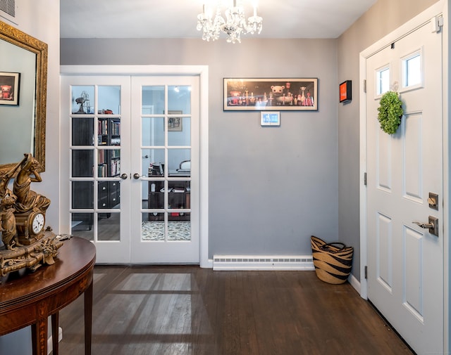 entryway featuring a notable chandelier, dark wood-type flooring, and french doors