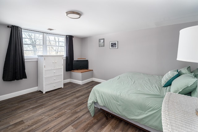 bedroom featuring dark hardwood / wood-style floors