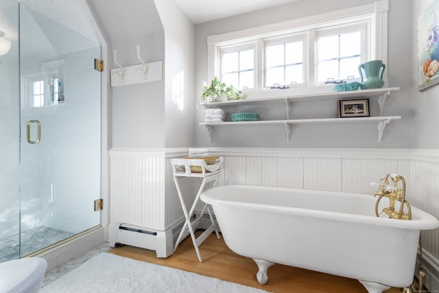 bathroom with baseboard heating, wood-type flooring, toilet, and independent shower and bath