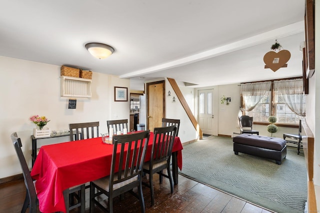 dining space with wood-type flooring