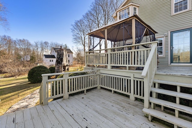 wooden terrace featuring a gazebo