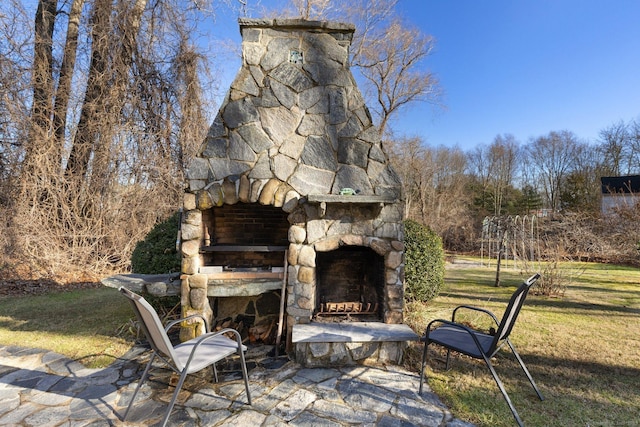 view of patio with an outdoor stone fireplace