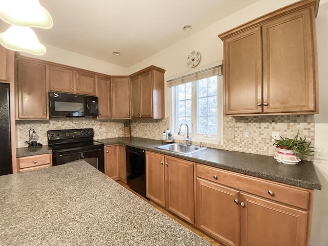 kitchen featuring sink, backsplash, and black appliances