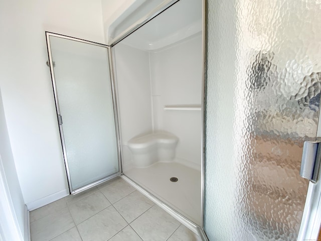 bathroom featuring tile patterned flooring and walk in shower