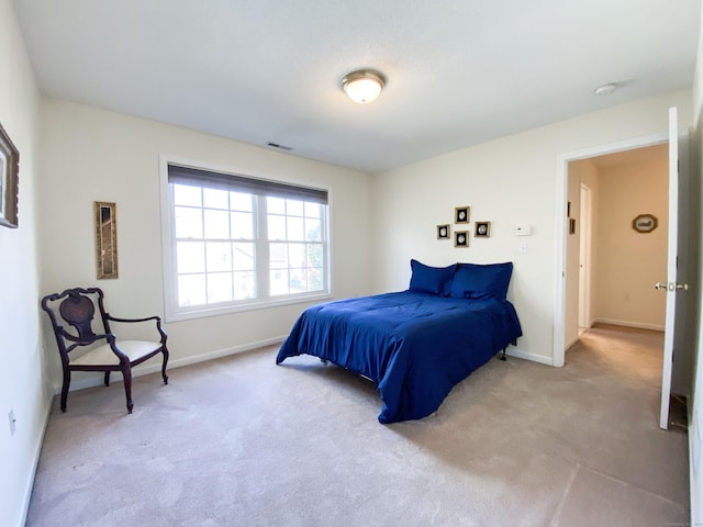 bedroom with light carpet