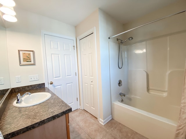 bathroom featuring tile patterned floors, vanity, and shower / bath combination