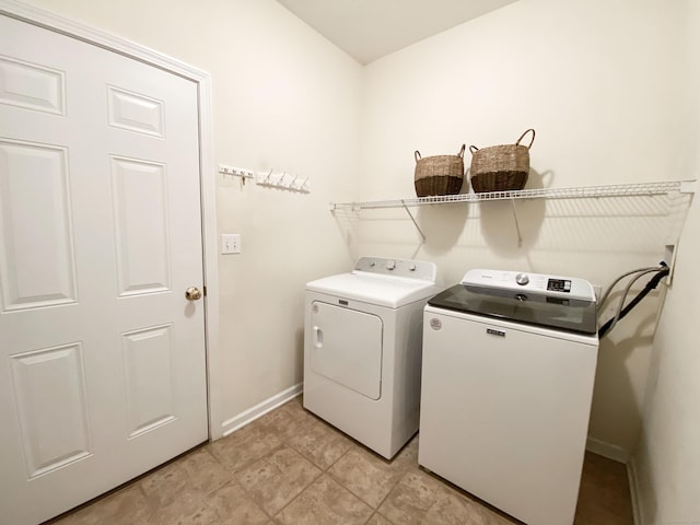 laundry room with washer and clothes dryer