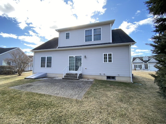 back of property featuring a patio and a lawn