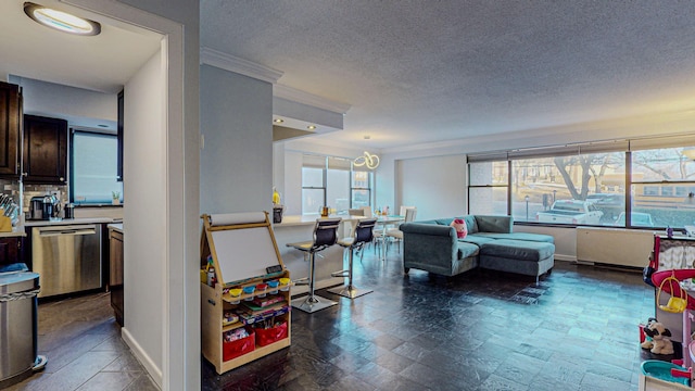 living room with plenty of natural light and a textured ceiling