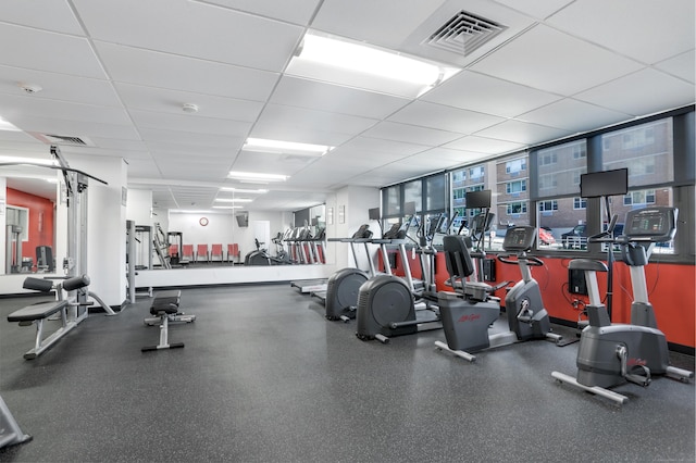 workout area featuring a paneled ceiling