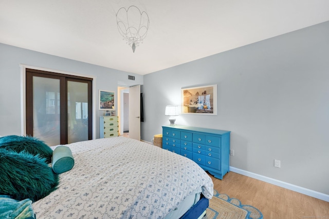 bedroom with light wood-type flooring