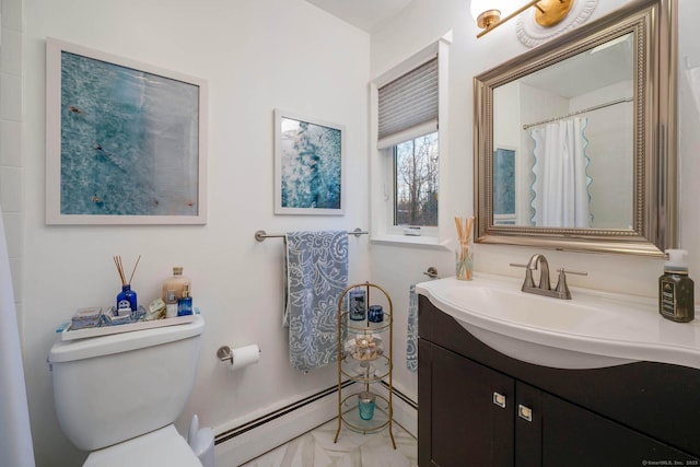 bathroom with vanity, a baseboard heating unit, and toilet