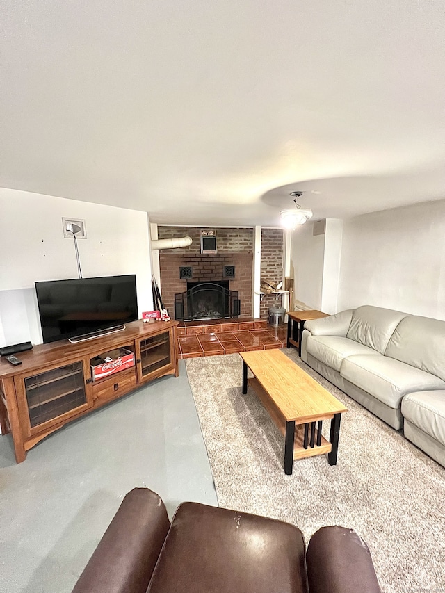 living room featuring a fireplace and concrete floors