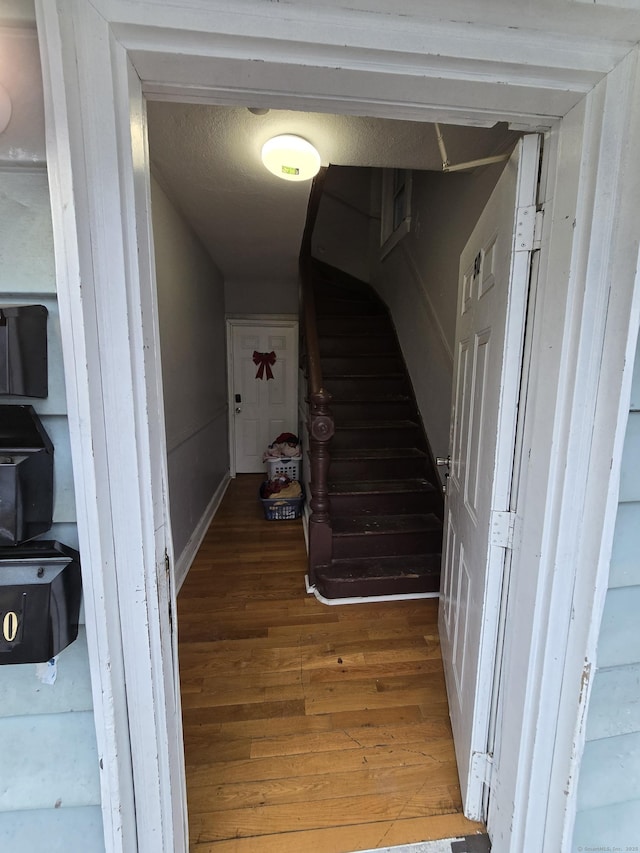 corridor featuring wood-type flooring