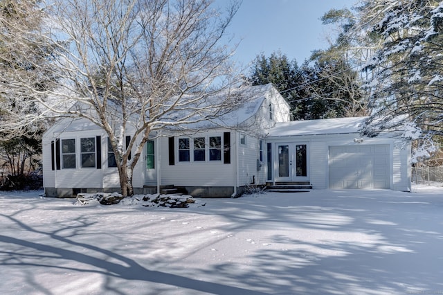 view of front of home featuring a garage and french doors