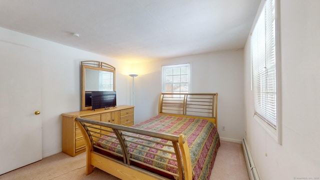 carpeted bedroom with baseboard heating