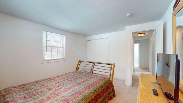 carpeted bedroom with a closet